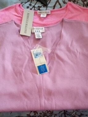 Two Sleeveless Tops One Pink and One Purple